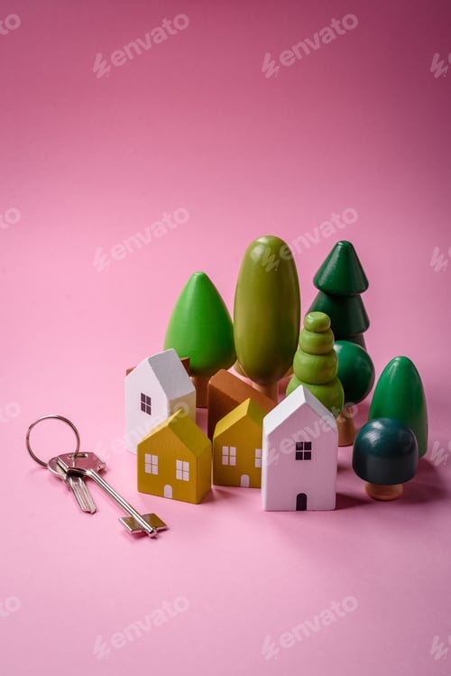 Preview: A small wooden house and keys as an idea for investing in your own home
