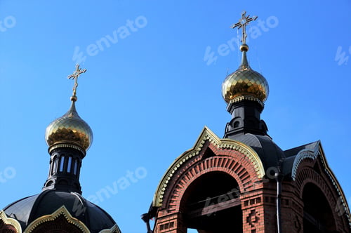 Preview: Two golden domes against a blue sky