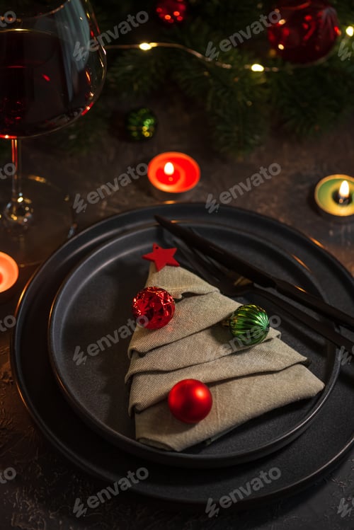 Preview: Christmas Table Setting with Tree-Shaped Napkin, Utensils, Ornaments and Tealight Candles