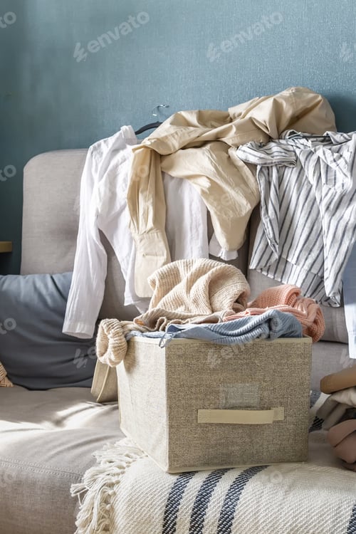 Preview: Spring cleaning,Fast fashion, the girl puts things in order in the closet. A bunch of colorful
