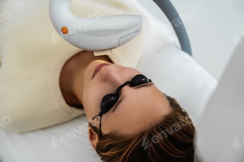 Preview: Phototherapy, photorejuvenation, IPL in a beauty salon. Care for a woman's face.