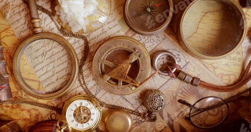 Preview: Vintage style travel and adventure. Vintage old compass and other vintage items on the table.
