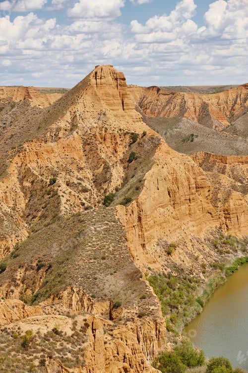 Preview: Red clay erosion gully and river. Eroded landscape. Spain
