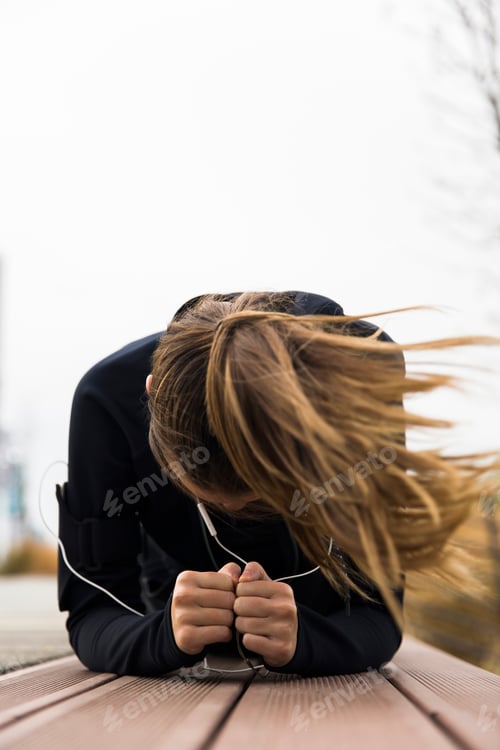 Preview: Young woman having a training on the windy day