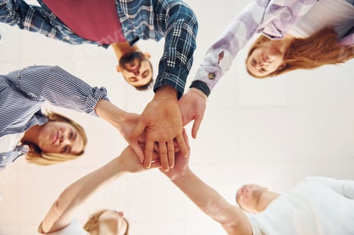 Preview: Holding each other's hands. Group of friends standing together