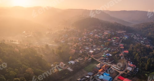 Preview: Sunrise over Thai tribe village in foggy with wild himalayan cherry tree blooming