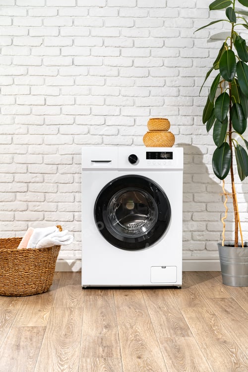 Preview: Washing machine and basket in a laundry room