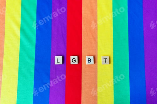 Preview: LGBT community, bright rainbow flag, wooden lettering. The rights of all people on the planet