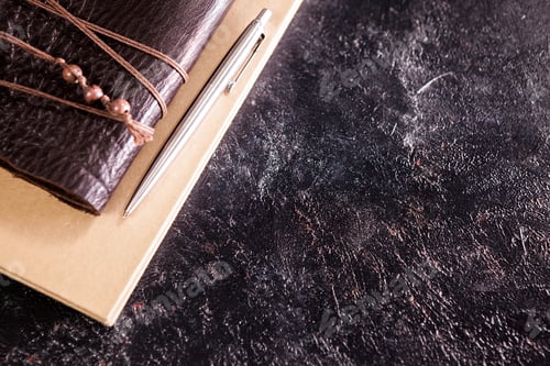 Preview: Hand made retro aged notebook diary on a dark board