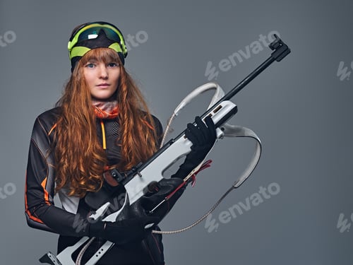 Preview: Studio portrait of a redhead female Biathlon champion.