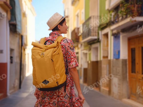 Preview: Woman strolls through colorful streets of Spanish coastal town