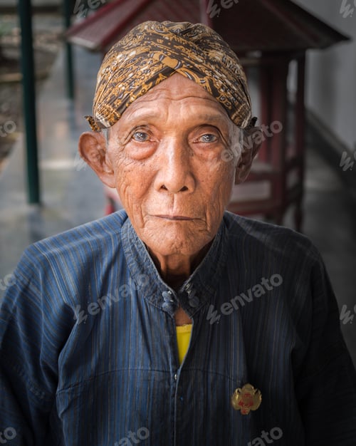 Preview: Java Island, Indonesia - August, 14 2015: Elderly ethnic person looking at camera