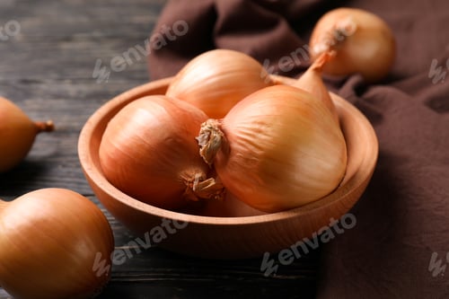 Preview: Bowl with fresh onion and kitchen towel on wooden background