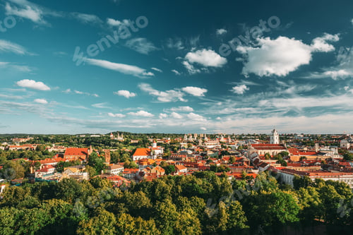 Preview: Vilnius, Lithuania. Old Town Historic Center Cityscape Under Dramatic Sky And Bright Sun In Sunny