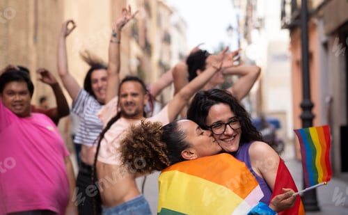 Preview: Happy LGBTQ community people enjoying and dancing on the gay parade MADO in Madrid city
