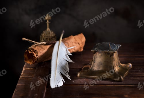 Preview: Ancient Inkwell, feather pen and old paper with a seal