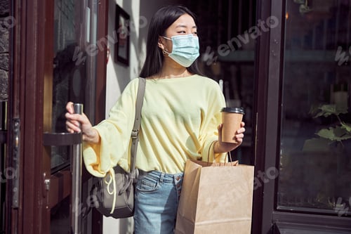 Preview: Photo of cheerful female leaving coffee shop