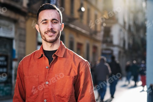 Preview: Man standing outdoors on the street.