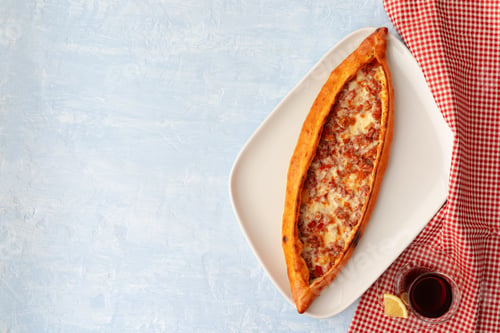 Preview: Turkish baked Pide bread on light blue wooden surface