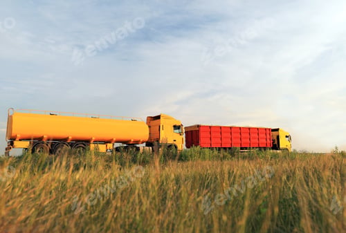Preview: Modern bright trucks parked on country road