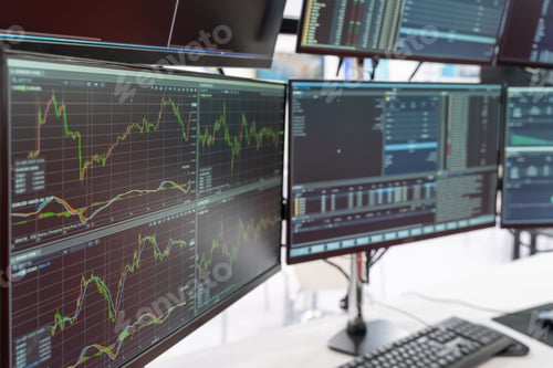 Preview: close view of stock market trending screens in modern office.