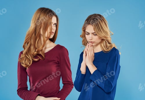 Preview: two girlfriends in dresses communication friendship fashion blue background