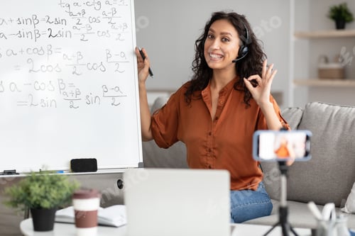 Preview: Female teacher showing okay gesture, explaining math to students