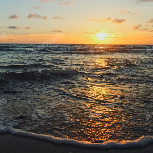 Preview: Beautiful sandy beach while sunset. Beautiful seascape of a sandy beach.