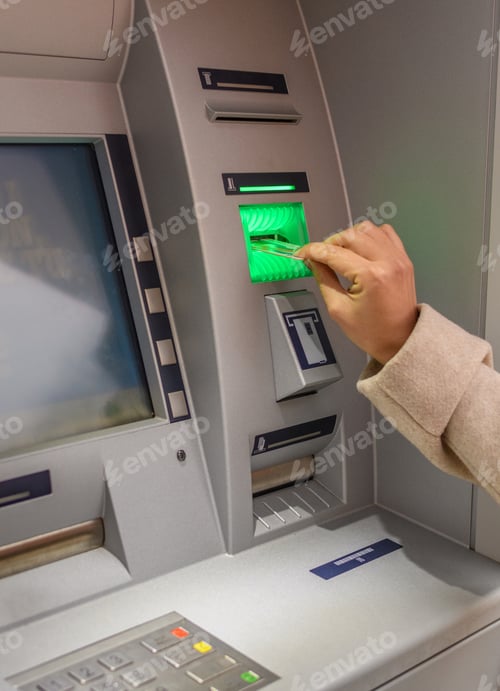 Preview: Woman inserting bank card into atm, Withdrawing money.