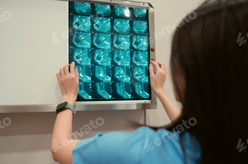 Preview: Doctor and patient's x-ray film in hospital examination room