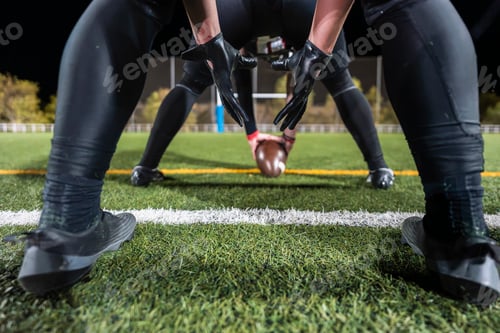 Preview: American football players preparing for line of scrimmage