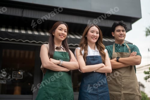 Preview: Portrait Group of Asian cafe owners entrepreneurs smiling in coffee shop, small business concept