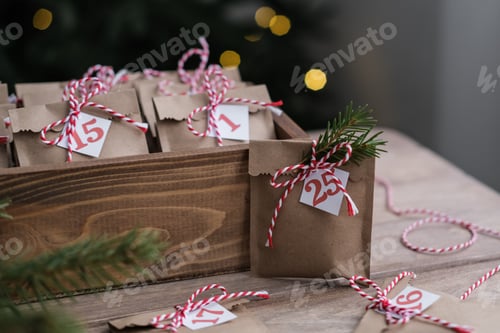 Preview: Preparing for Christmas. Christmas advent calendar. Eco paper craft bags with small gifts for kids.