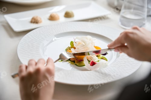Preview: Woman eating appetizer salad in luxury restaurant, close up