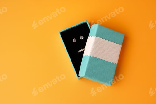 Preview: Jewelry box on yellow background top view