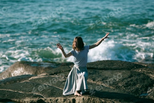 Preview: The Young Dancers Woman Is Engaged In Choreography On The Rocky Coast Of The Ocean.