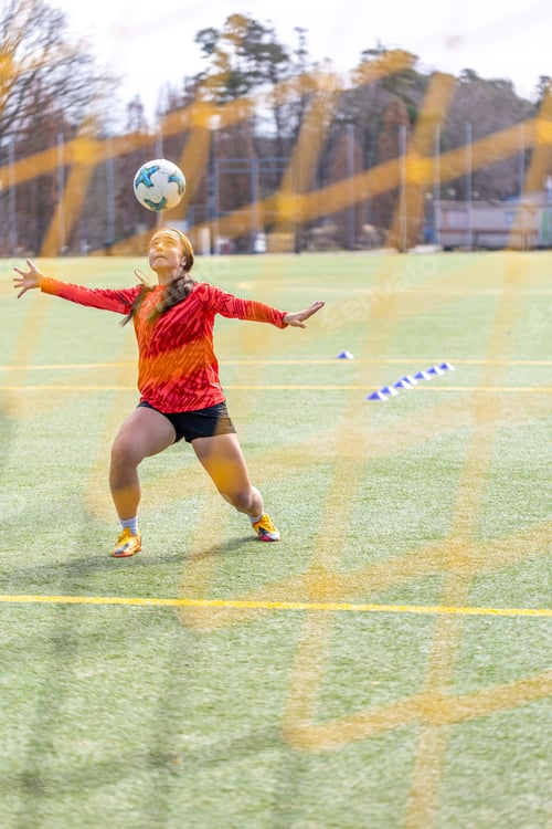 Preview: Girl on the soccer field. Soccer training. Active lifestyle. Football concept.