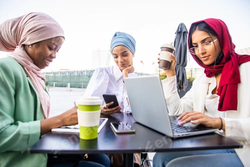 Preview: Beautiful muslim girl wearing hijab bonding outdoors