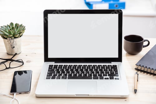 Preview: Laptop with white blank screen on a wooden desk