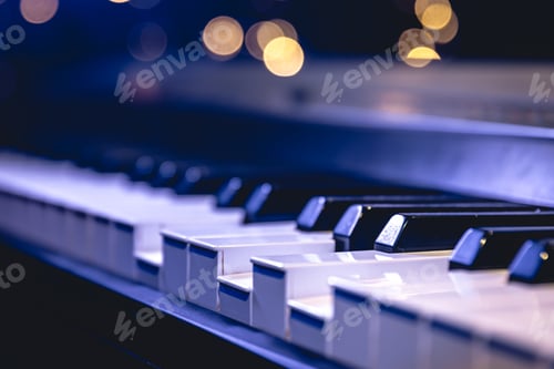Preview: Piano keys close-up on a blurred background with bokeh.