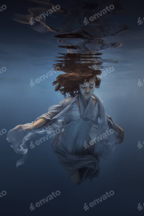 Preview: Portrait Of A Girl In A Blue Dress Under Water