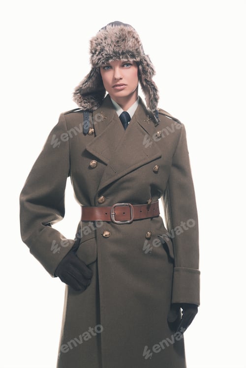 Preview: Winter Retro Army Woman Wearing Coat With Belt And Hat. Isolated Against White.