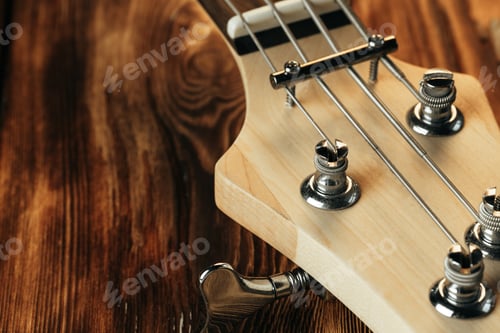 Preview: Guitar headstock with tuners on dark background