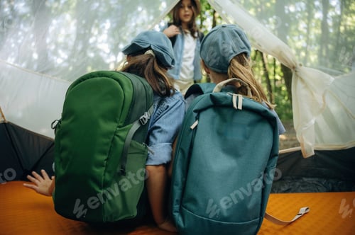 Preview: Backpacks are full. Happy kids are with tent in the forest