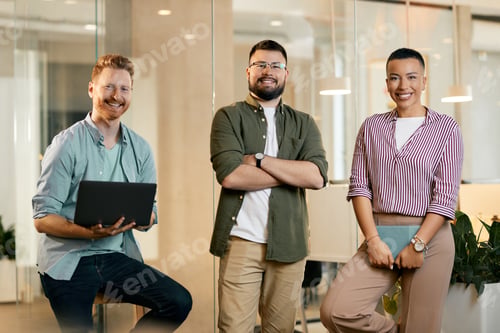 Preview: Portrait of young happy entrepreneurs in the office looking at camera.