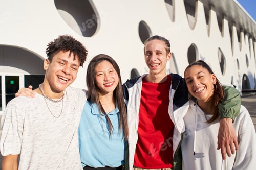 Preview: Portrait of a group of students smiling looking at the camera.