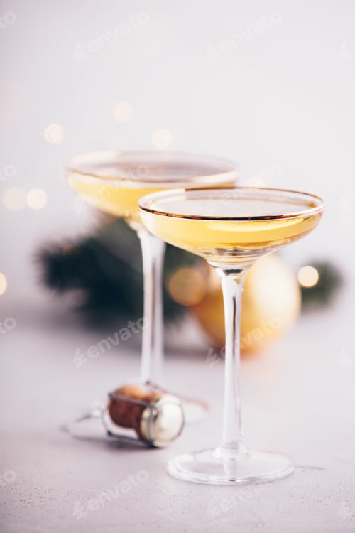 Preview: Two champagne glasses, cork and Christmas decorations