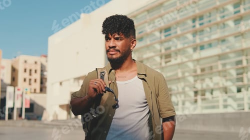 Preview: Close up, young smiling man dressed in an olive-colored shirt
