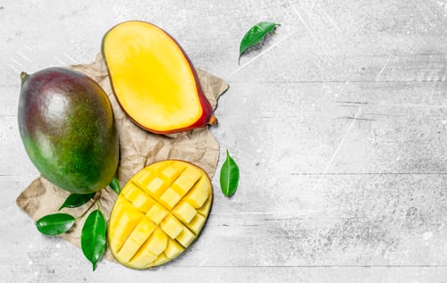 Preview: Ripe mango on paper.