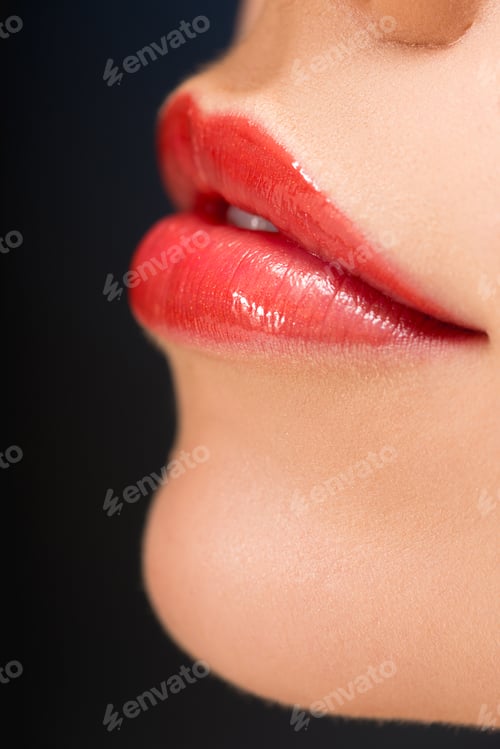 Preview: cropped view of female red lips isolated on black